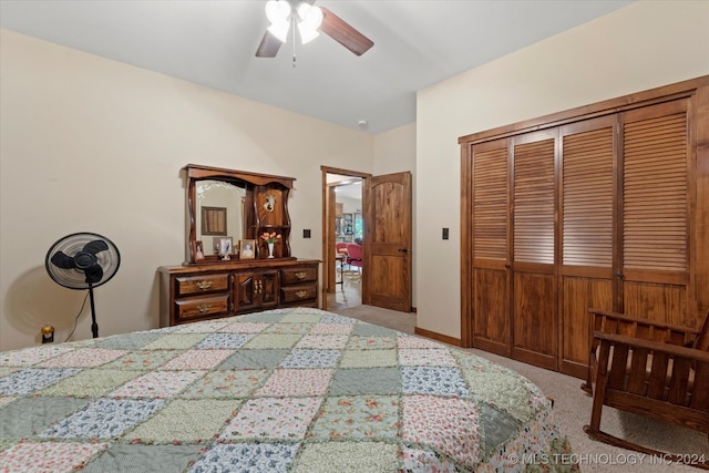 carpeted bedroom featuring a closet and ceiling fan