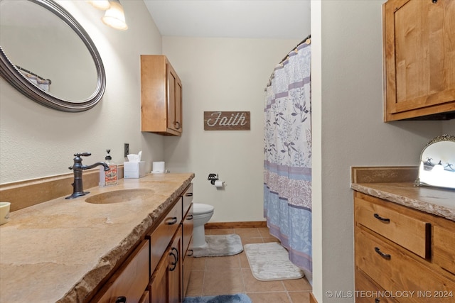 bathroom with tile patterned flooring, vanity, toilet, and a shower with curtain