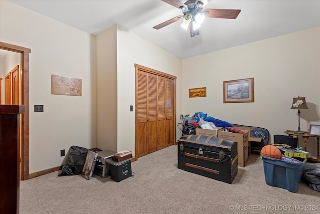 carpeted bedroom with a closet and ceiling fan