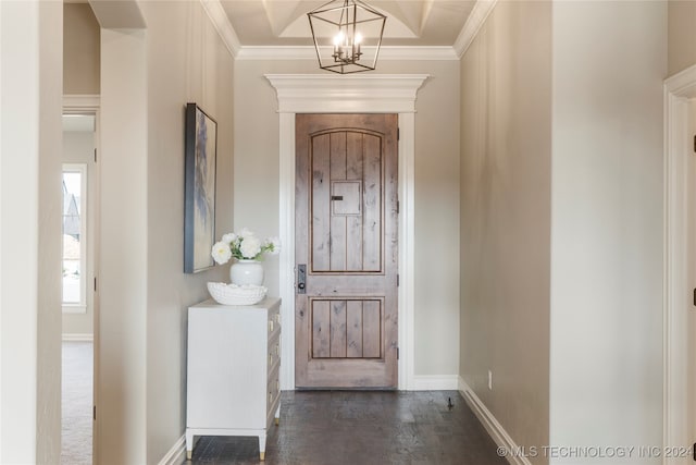 foyer entrance featuring crown molding, a notable chandelier, and dark hardwood / wood-style floors