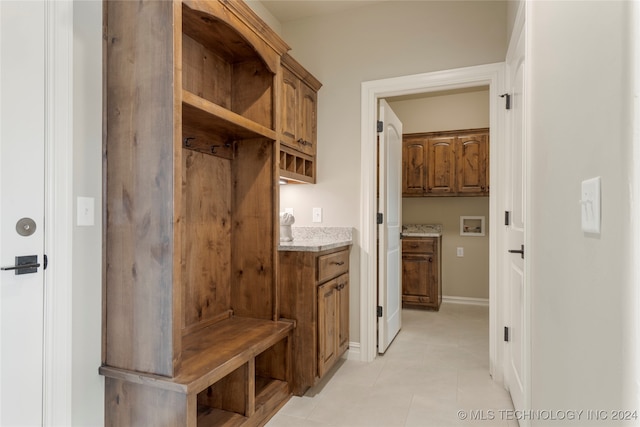 mudroom with light tile patterned floors