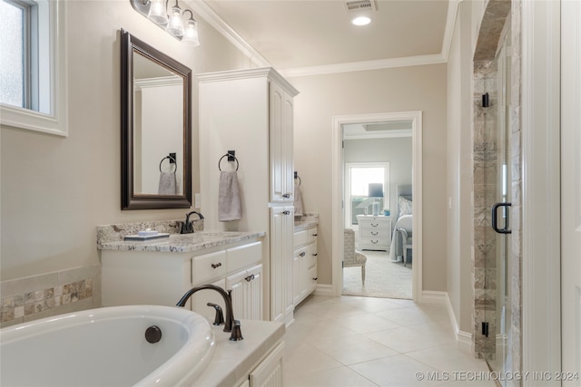 bathroom with plus walk in shower, tile patterned flooring, crown molding, and vanity