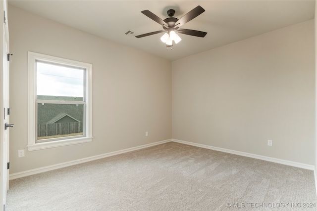 carpeted empty room with ceiling fan