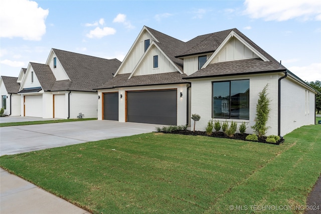 view of front facade with a garage and a front yard