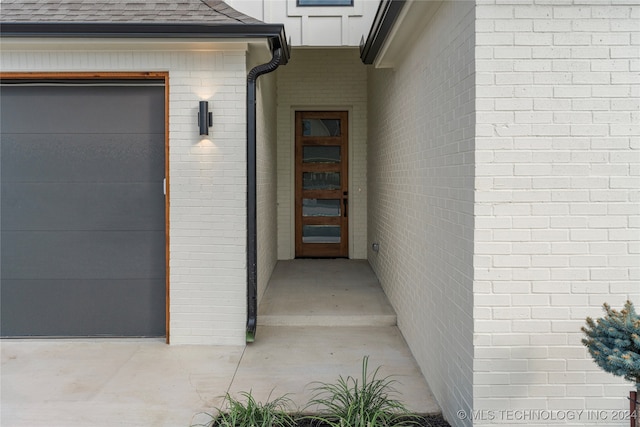 property entrance with a garage