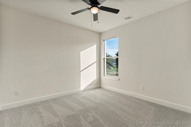 empty room with light carpet and ceiling fan