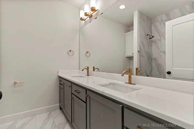 bathroom featuring a shower and vanity