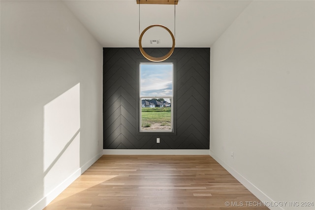 spare room with light wood-type flooring