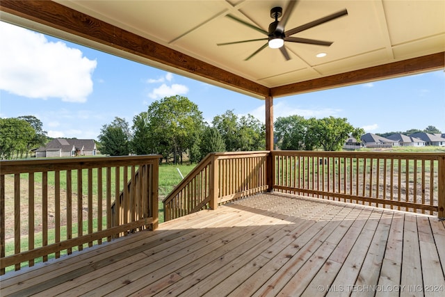 deck featuring a yard and ceiling fan