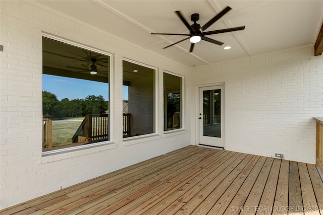 wooden deck featuring ceiling fan