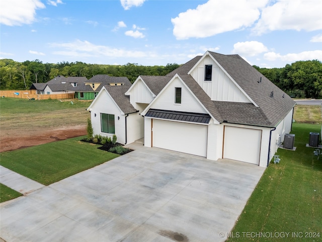 modern inspired farmhouse featuring cooling unit, a garage, and a front lawn