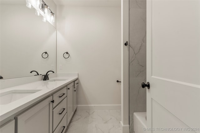 bathroom with vanity and a tub