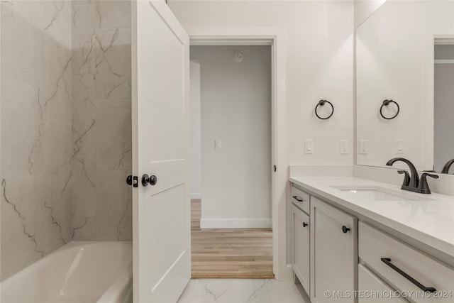 bathroom featuring vanity and hardwood / wood-style floors