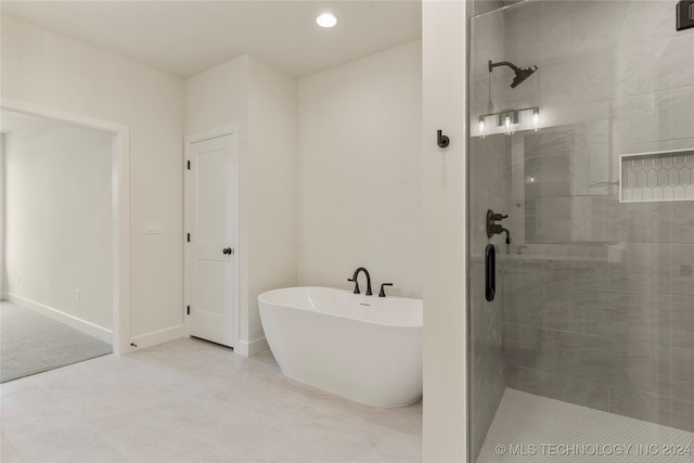 bathroom with plus walk in shower and tile patterned floors