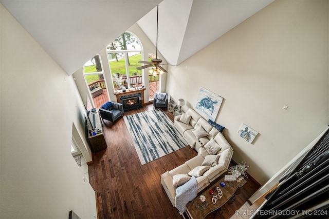 living room with high vaulted ceiling, hardwood / wood-style flooring, and ceiling fan