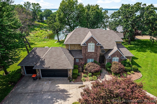 view of front of property featuring a front yard and a water view