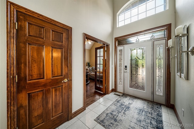 tiled entrance foyer featuring a wealth of natural light