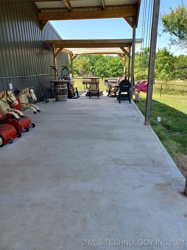 view of patio with a gazebo and an outdoor fire pit