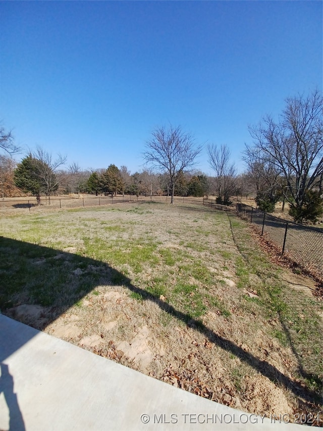 view of yard with a rural view