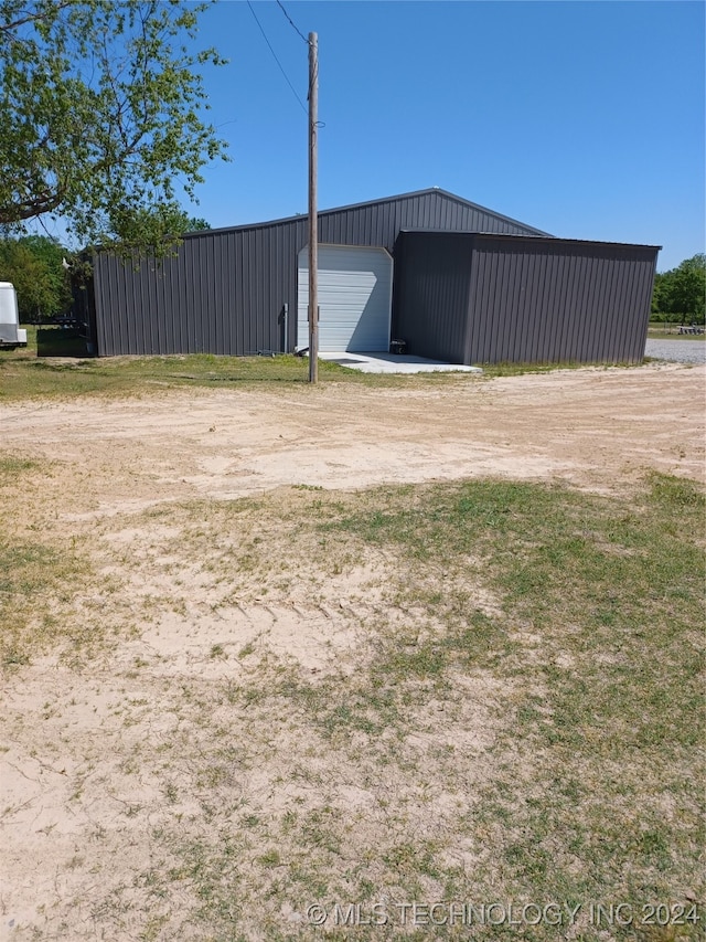 view of outbuilding with a garage