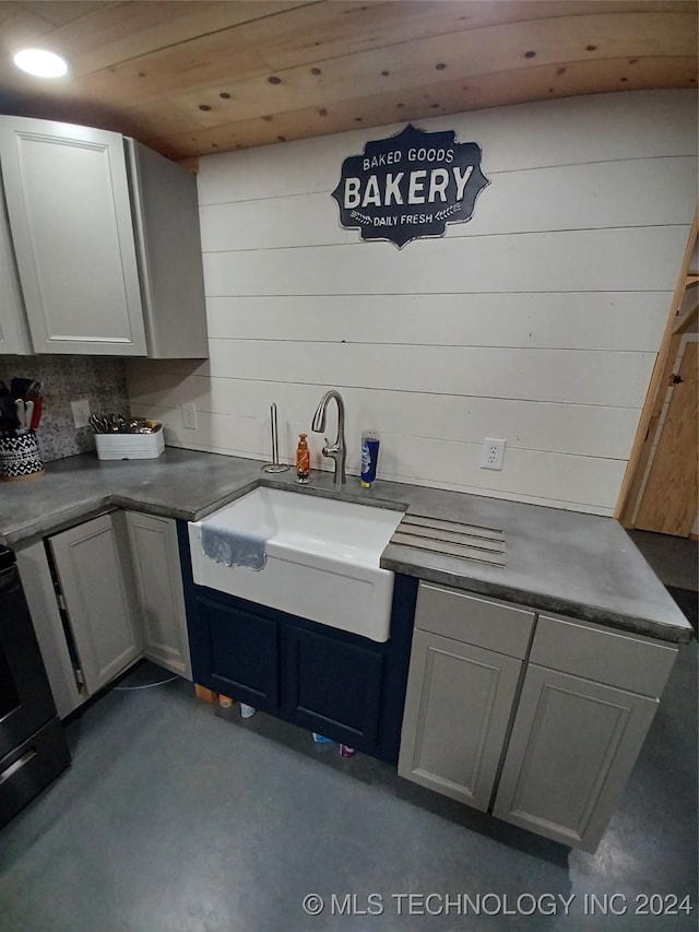 kitchen featuring gray cabinets, wood ceiling, and sink