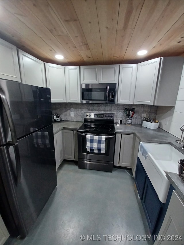 kitchen featuring wood ceiling, appliances with stainless steel finishes, and white cabinetry