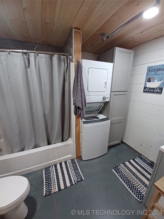 interior space featuring wooden walls, stacked washer and dryer, and wooden ceiling