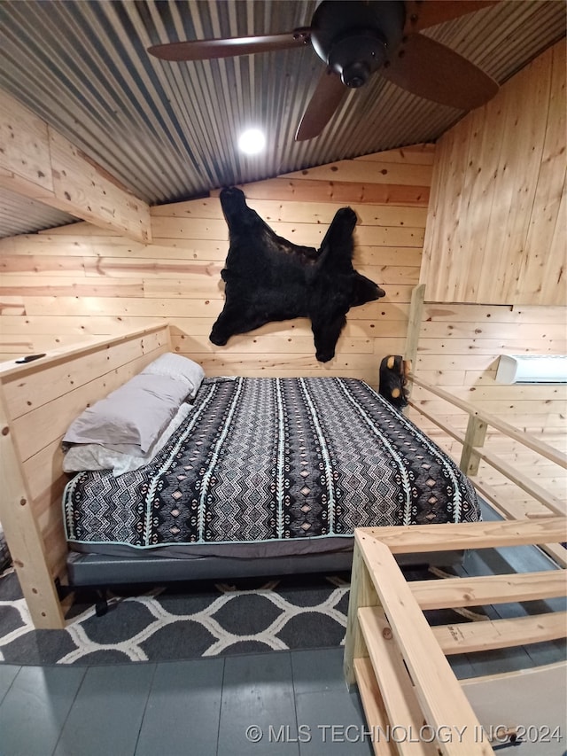 bedroom with lofted ceiling, wood walls, and wooden ceiling