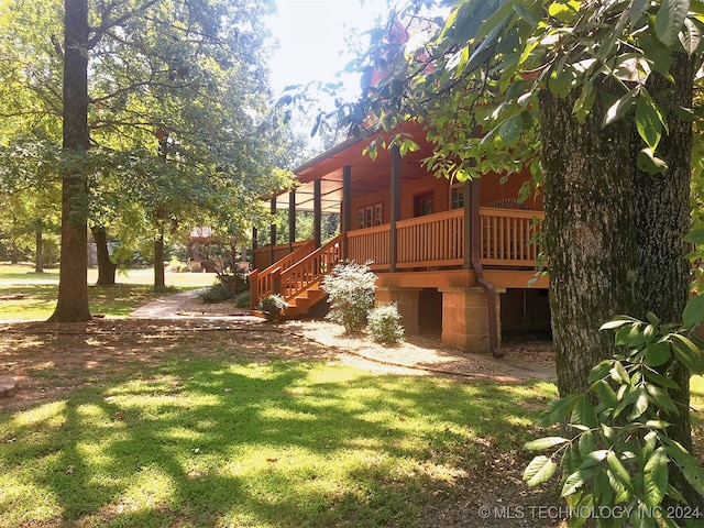 view of yard featuring a wooden deck