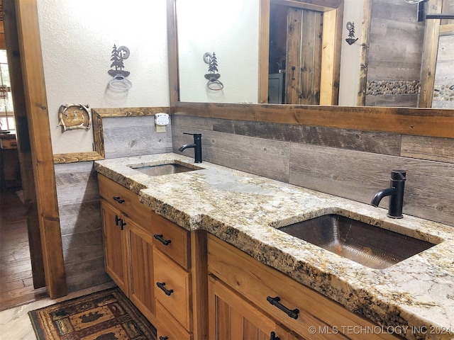 bathroom with vanity and hardwood / wood-style flooring