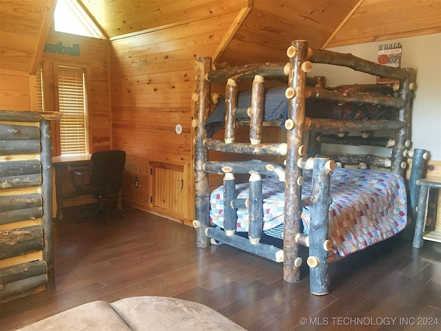 bedroom with wooden ceiling, vaulted ceiling, dark wood-type flooring, and wooden walls