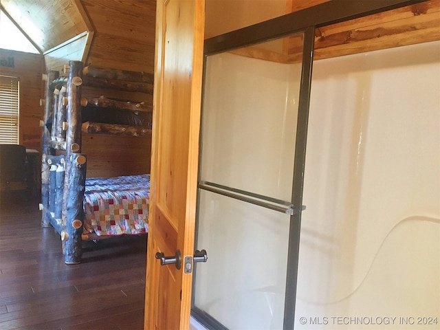 bathroom with wooden ceiling and hardwood / wood-style flooring