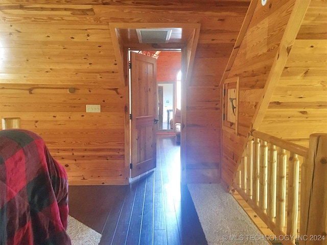 corridor with wooden ceiling, wood-type flooring, and wood walls