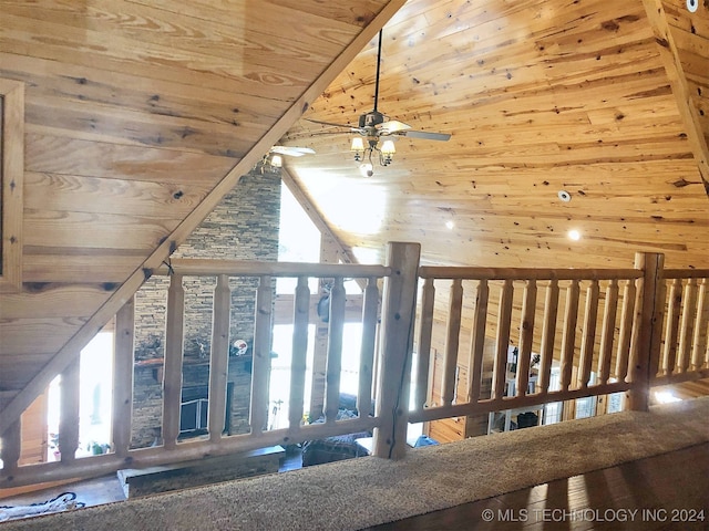 interior space with ceiling fan, wood walls, high vaulted ceiling, and wooden ceiling