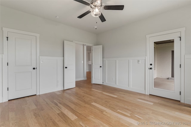 unfurnished bedroom featuring ceiling fan and light hardwood / wood-style floors