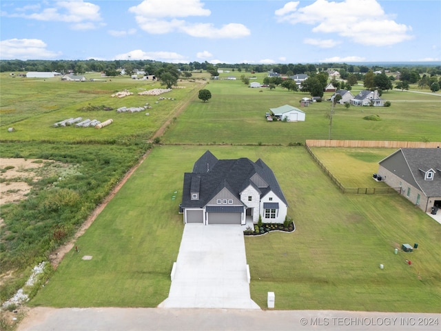 birds eye view of property featuring a rural view