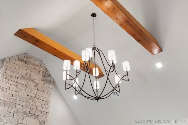 room details featuring a notable chandelier and beam ceiling