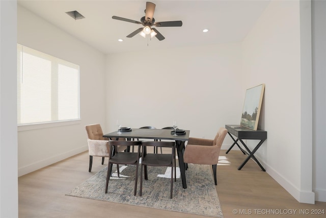 dining room with ceiling fan and light hardwood / wood-style floors