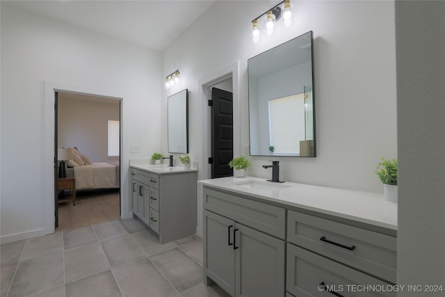 bathroom featuring tile patterned flooring and vanity