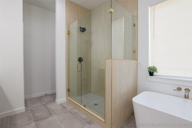 bathroom featuring separate shower and tub and tile patterned flooring