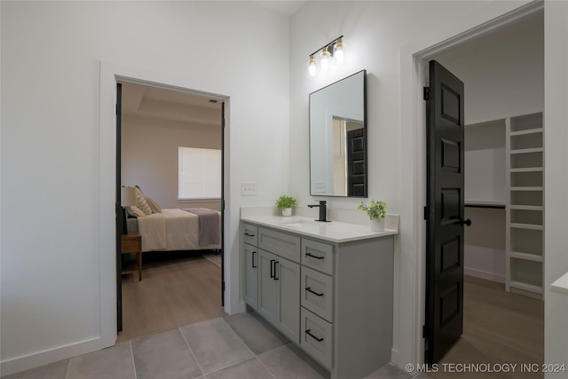 bathroom with hardwood / wood-style flooring and vanity