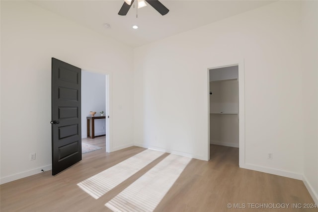 spare room with ceiling fan and light hardwood / wood-style flooring