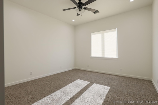 empty room featuring carpet flooring and ceiling fan