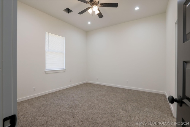 empty room featuring ceiling fan and carpet floors