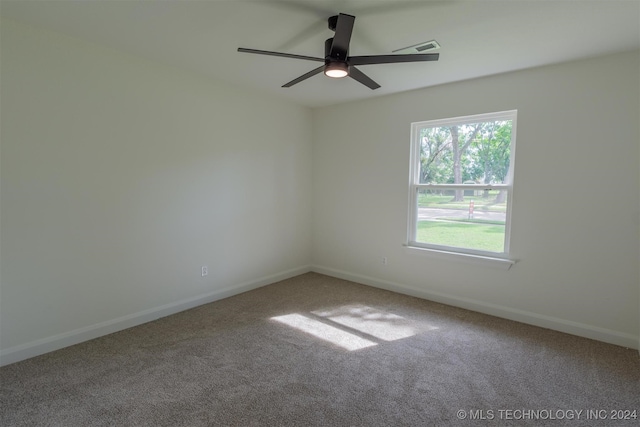 carpeted empty room featuring ceiling fan