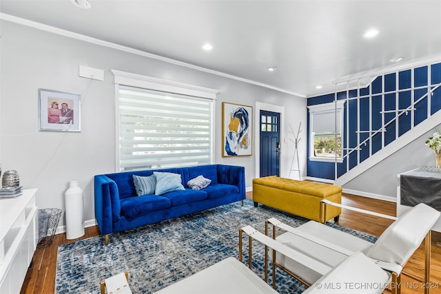 living room with ornamental molding and hardwood / wood-style floors