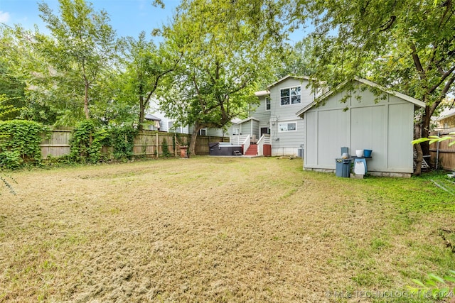 view of yard featuring a storage unit