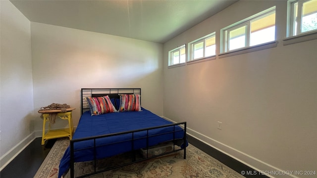 bedroom featuring multiple windows