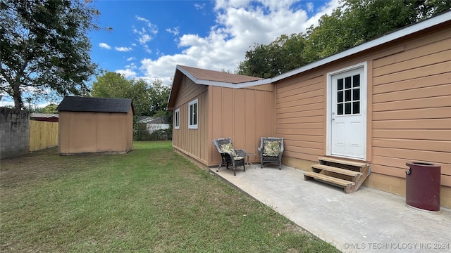 view of yard with a storage unit and a patio