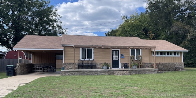 single story home with a front yard and a carport